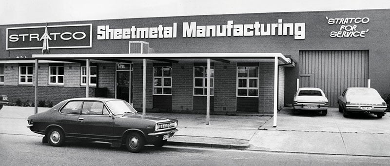 Stratco Sheet Metal Manufacturing Building with vintage car parked in front